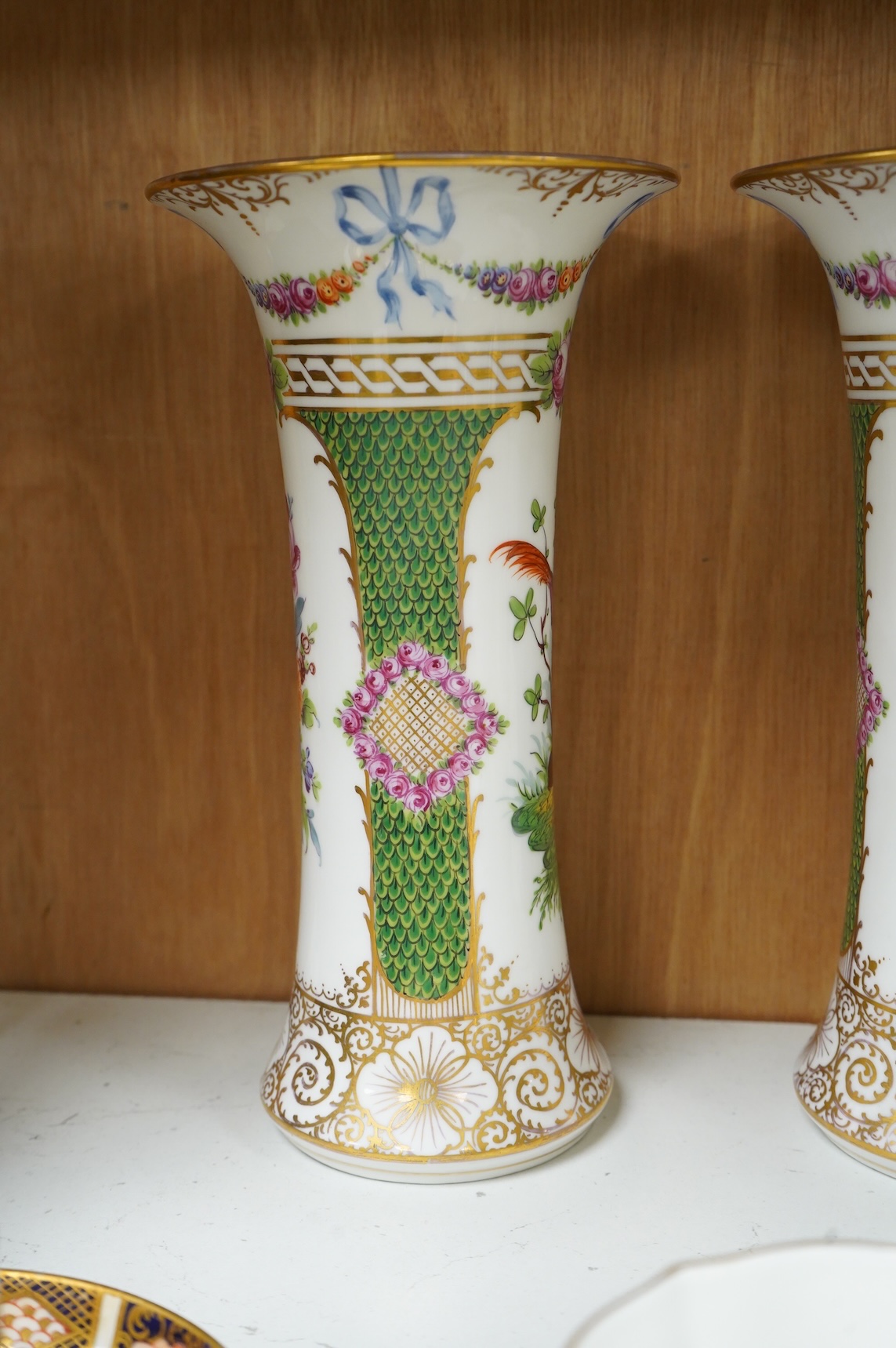 A pair of Dresden vases, a Paris porcelain bottle and stopper, a faience bowl and two Royal Crown Derby cups and saucers, tallest 26cm